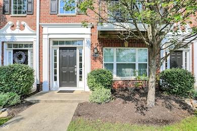 view of exterior entry with brick siding