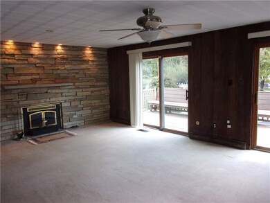 Family Room off Kitchen has beautiful stone firepl