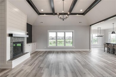 The foyer leads into a Great Room offering a tripl