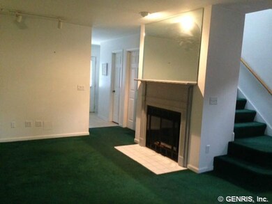Living Room. The fireplace has a mantle and mirror