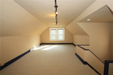 The third floor is a large open space with neutral