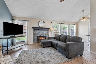 With its gas fireplace, vaulted ceilings, and stre
