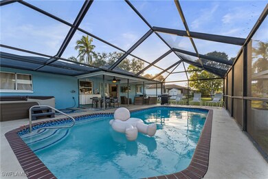 View of pool with ceiling fan, a patio, a hot tub,
