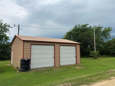 Garage with a lawn