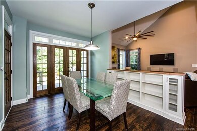 Breakfast area with custom built-ins. Opens to dec