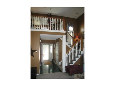 Dramatic two-story entry opens to the Great Room a