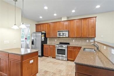 Granite counter tops and tile floors in kitchen