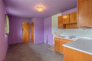To the left of the main entrance is the kitchen.