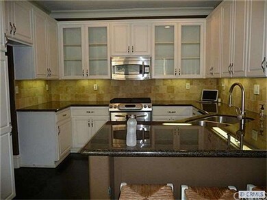 Kitchen with granite and stainless appliances