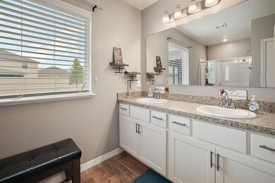 Ensuite bathroom with dual vanity and tons of natural light