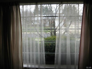 Front picture window looking out onto Highland St.