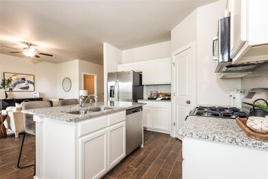 Photo of same floorplan - cabinet, countertop and 