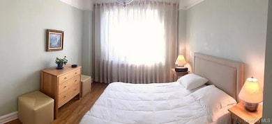 Bedroom featuring wood finished floors