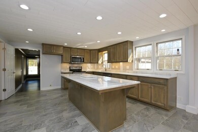 Beautifully updated kitchen with custom built cabinets. 