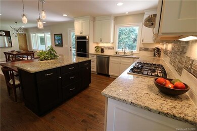 The dark cabinets of the island offer a nice contr