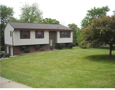Exterior Front. Expansive front yard and 2 car int