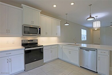 Kitchen featuring stainless steel appliances, a pe