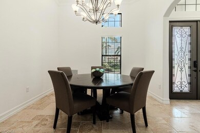 Dining area with a notable chandelier, crown moldi