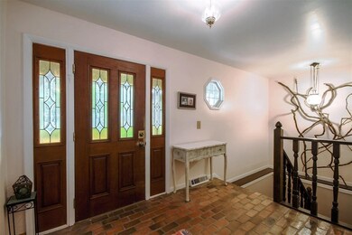 Large entry foyer with brick flooring