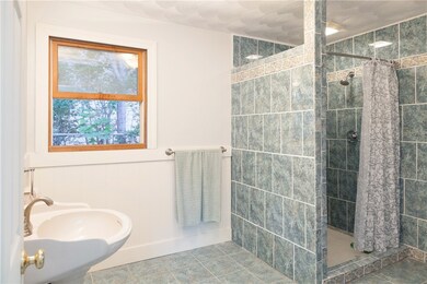 Oversized bathroom with lovely tile work.