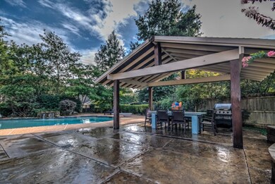 Gunite Pool with Waterfall, Stamped Stained Concre