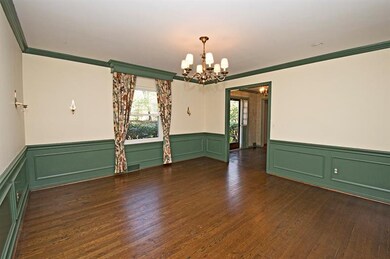 Dining room with beautiful moldings and hardwood f