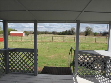 Covered Porch with view of acreage.