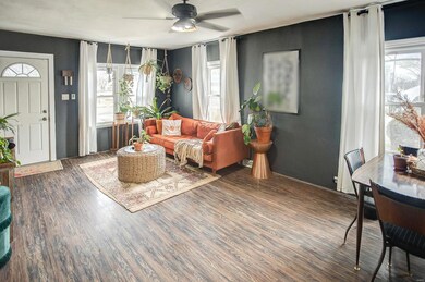 The living/dining room offers an abundance of natural light.
