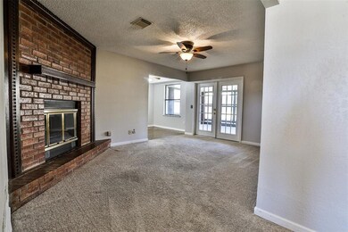 Unfurnished living room with french doors, dark ca