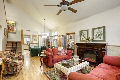 Living room with wood finished floors, a high end