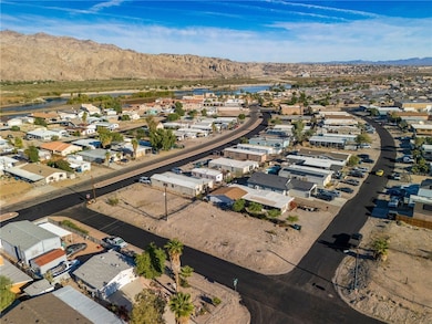 View of property location with nearby suburban area and a water and mountain view