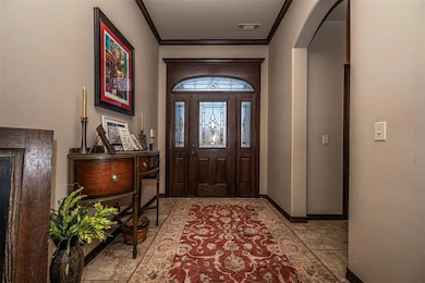 Foyer featuring crown molding