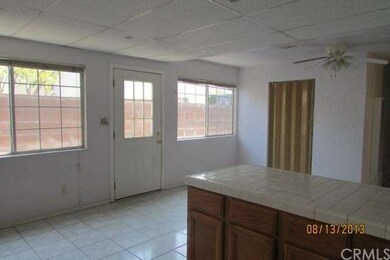 behind the folding doors is the laundry room