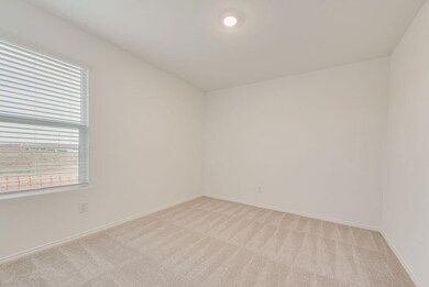 Spare room featuring light colored carpet and base