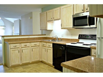 Kitchen with lots of cabinets and newer countertop
