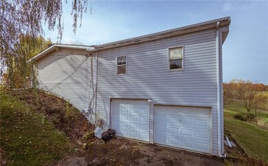 Two extra large garages with one tall door.  The t