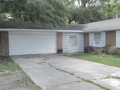 View of 2-car garage, 52 foot driveway and entranc
