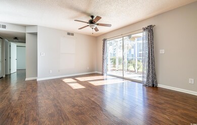 Spare room featuring a textured ceiling and dark w
