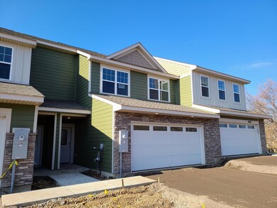 Fairfax Building exterior shown with Mountain Sage Hardi siding and Khaki Brown board & batten.  Ask Sales Agent for details.