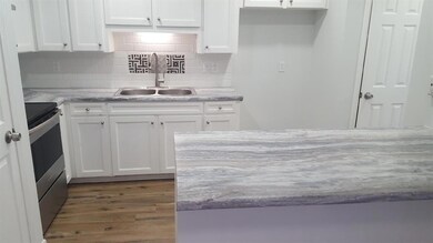 Beautifully updated kitchen with pantry, granite l