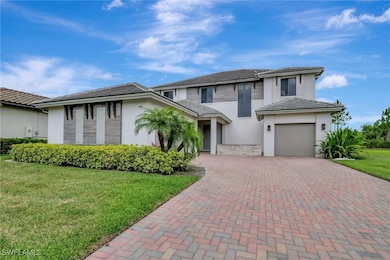Prairie-style house featuring decorative driveway,
