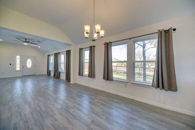 Looking from the kitchen to the front door- so muc
