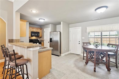 Breakfast bar adds additional seating for guests or family