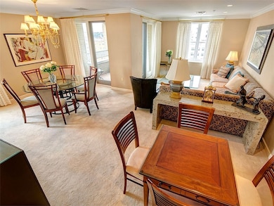 Open concept dining, living and card area. The terrace is in the background.