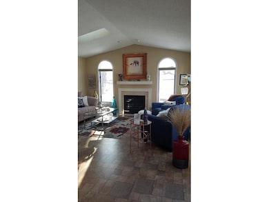 Beautiful addition has gas fire place tiled front 