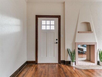 Entrance foyer featuring dark wood-type flooring