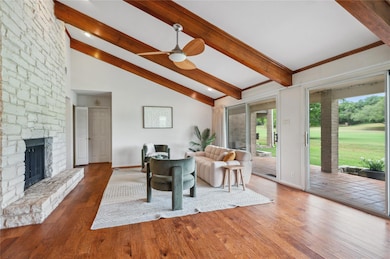 Living room with baseboards, lofted ceiling with 