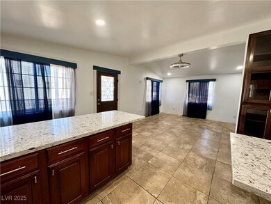 Kitchen featuring light tile patterned floors, vau