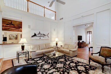 The great room provides a wet bar, surround sound and handsomely painted wood paneling