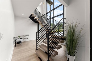 Stairs featuring wood finished floors and recessed lighting